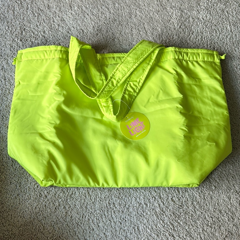 Ulta side-cinch tote bag w/snap close. Lime green.  20”L x 14” H x 8” W. NWT